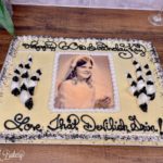 Photo birthday cake on a wooden table.
