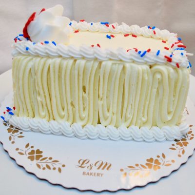 Red, white and blue pound cake on a white display board.