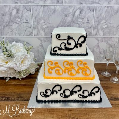 Black and orange three tiered wedding cake.
