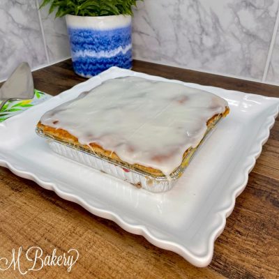French apple pastry on a white serving tray.