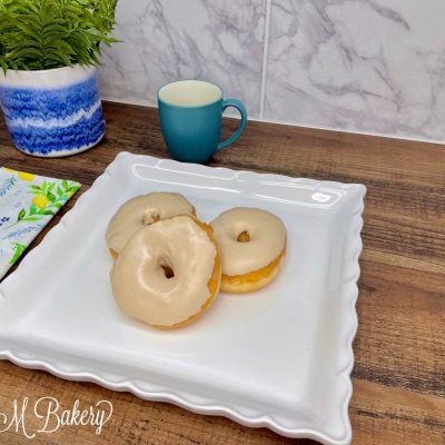 Peanut butter ring donut on a white serving tray.